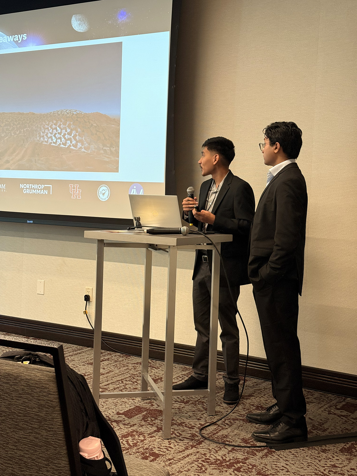 Anand and Erick presenting at the Texas Earth & Space symposium (Texas A&M, 2026)