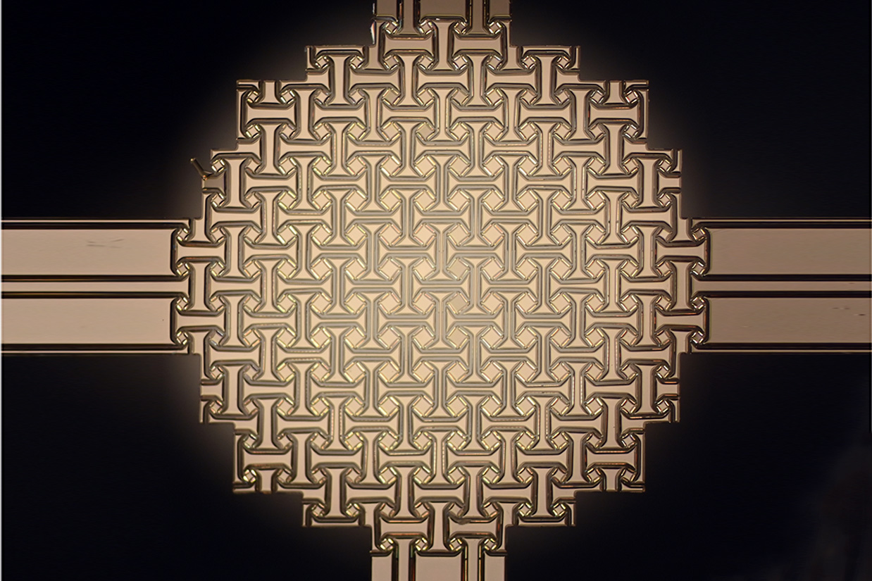A wafer-fabricated planar precursor deploying into a doubly-curved 3D dome