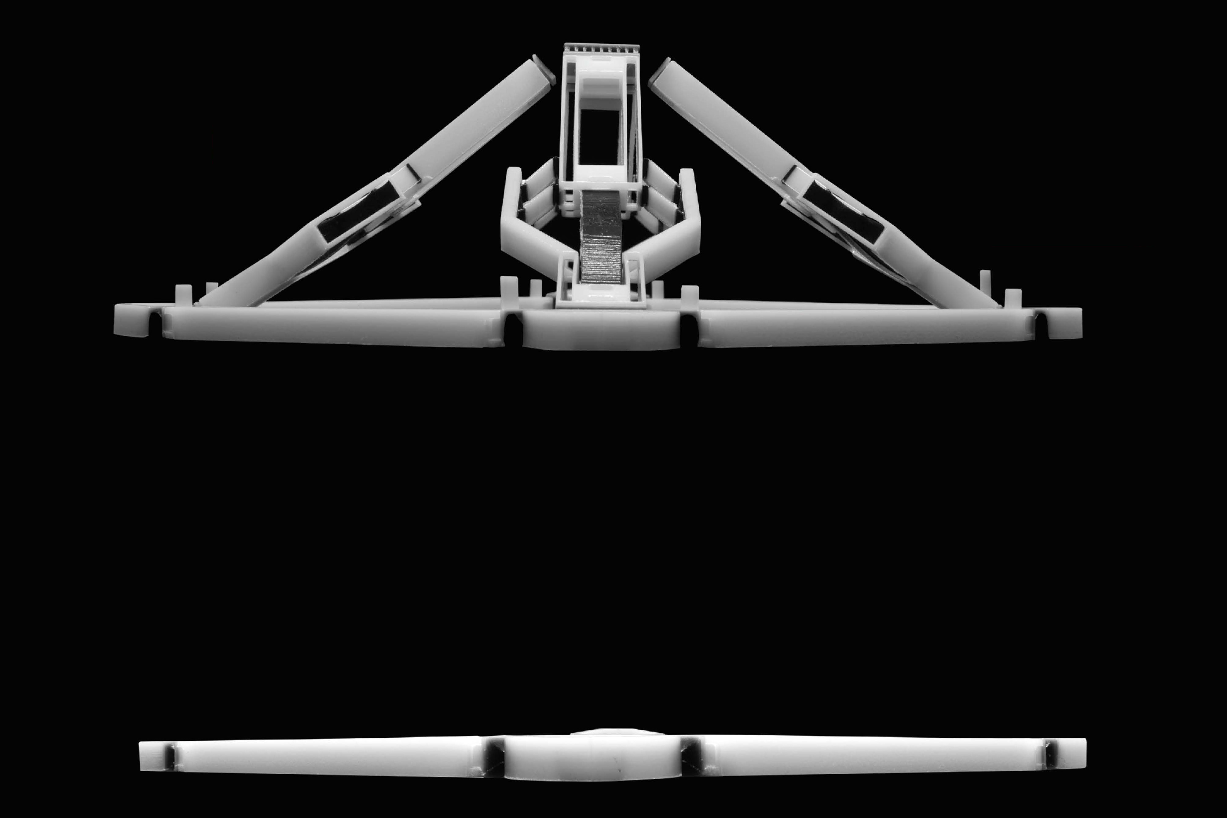 A flat multi-material 3D print that deploys into a stable doubly-curved 3D structure